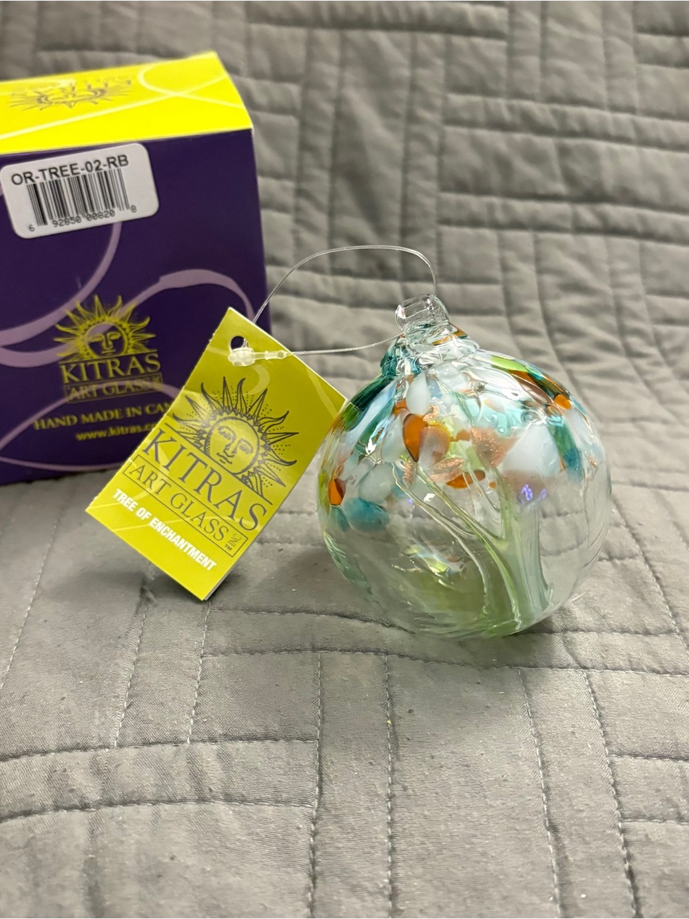 Kitrās Hand-Blown Glass Ornament - Clear with Teal & Orange Accents